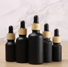 Essential Oil Bottle Matte Black Glass e liquid Essential-Oil Perfume Bottles with Reagent Dropper and Wood Grain Cap DHL SN3282