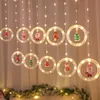 クリスマスの装飾のカーテンの弦のライトラウンドリングサンタ漫画ぶら下がっている窓の窓口