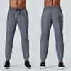 lu yoga vêtements hommes nouveau automne et hiver séchage rapide couleur unie sports et loisirs course pantalon de fitness ample avec poches lu-C621