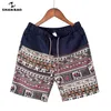 Homens e mulheres modelos lazer shorts moda algodão costura de costura verão br frisado flores impressas praia 210806