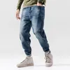 Jeans da uomo Moda Streetwear Uomo Retro Blu Spliced Designer Denim Cargo Pantaloni Harem Loose Fit Pantaloni da jogging Hip Hop