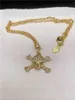 Европейская и американская мода золотой серебристый полный алмазный жемчуг маленький череп двойной кость сатурн ожерелье
