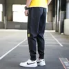 Pantaloni da uomo Pantaloni casual da studente coreano Sport da adolescente Ragazzi grandi Belli pantaloni sottili a 9 punti primaverili ed estivi