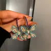 Orecchini pendenti con cristalli di zirconi a farfalla dorata per donna Accessori per gioielli da festa per matrimoni con strass blu