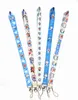 Fabrikspris 100 stycken Doraemon Anime Lanyard Nyckelring Halsrem Nyckel Kamera ID Telefonsträng Hänge Märke Fest Presenttillbehör Partihandel