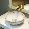 زهرة بيضاء الصين الحمام البضائع الصينية الفن مكافحة الأعلى السيراميك غسل اليد حوض الحمام بالوعة