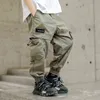 韓国の綿のズボンのための韓国の男の子のソリッドカラーの緩い貨物のズボン春秋2021年の長いズボンの大きなポケット付き4 8 12 14年G1220