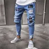 Pantalones vaqueros de moda para hombre Tendencia Agujero en la rodilla Leggings con cremallera Pantalones de mezclilla bordados Pantalones multicolores de tela cómoda