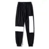 Pantaloncini da uomo Pantaloni sportivi da uomo Spiaggia per l'autunno Primavera Stile Pantaloni lunghi unisex Pantaloni sportivi con lettere in rilievo Coulisse Regolabili Capispalla Capris Street Sweaterpants