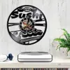 Japansk mat Vinyl Rekord Väggklocka Modern Design Sushi Rolls Väggklocka Dekorera Sushi Bar Japanska Sashimi Restaurant 210930