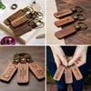 Groothandel promotionele gift hoge kwaliteit houten sleutelhanger riemen luxe lederen sleutelhangers creatief ontwerp hout sleutelhanger aangepaste logo