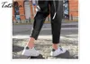 Осень зима черная искусственная кожа женские брюки эластичные талии женские PU Harem Streetwear Chic брюки плюс размер 210514