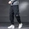Męskie spodnie Multi Pocket Cargo Mężczyźni Streetwear Joggers Deskorolka Szeroka noga Luźna Kostka Długość Spodnie Techwear Ubrania