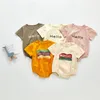 Sommar baby kläder brev spädbarn pojke t-shirt bomull nyfödd tjej romer kortärmad barn jumpsuit boutique baby kläder dw5572