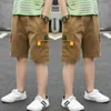 韓国の赤ちゃんの固体貨物ズボンの夏のショートパンツ緩い子供たちのショートパンツズボン服十代の12年210622