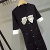 Högkvalitativ bågsknapp Stickad sommarklänning Vintage Mini Vestidos Koreansk Elegant Svart Casual Party Ropa Mujer Robes 210514