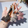 Mode diamant griffe chaîne français combat chien porte-clés dessin animé poupée pendentif cadeau créatif haut de gamme