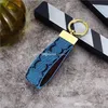 Keychain Brand Designer Key Chain Mens Luxury Car Keyring Womens Fashion Bee Buckle Handgjorda läderväskor Pendant Tillbehör Multicolor