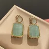 High quality light luxury olivine green jade earrings with purple diamond Tsquare zirconium wind earrings on the side7818324