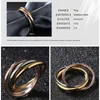 Fashion classique créatif trois anneaux sinueux Women039s en acier inoxydable 3 Color Trinity Rolling Band Rings6725039