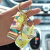 Keychains Bubble Keychain kreativer Milch Tee Tasse Flüssigkeit Kristall Quicksand Pendel Schlüsselringbeutel Anhänger für Frauen Schlüsselkette 4314717