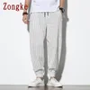 Zongke listrado calças casuais homens japoneses streetwear corredores calças calças harajuku hip hop 5xl primavera 210715