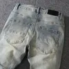 Jeans pour hommes lavés en Europe et en Amérique pour fabriquer de vieux pantalons cousus, qui sont à la mode.