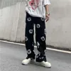 Męskie jeansy w stylu Patchwork Casual Flower Print Męskie Vibe Proste spodnie Harajuku Ripped Oversize Denim Spodnie Streetwear