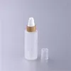 Bouteilles de stockage en verre transparent avec pompe à lotion en bambou Bouteilles d'émulsion Emballage cosmétique vide 1983 Y2