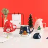 Canecas Chapéu de Santa Claus dos desenhos animados Garrafa de água cerâmica impressa com a colher da tampa Crie uma atmosfera festiva Caneca de café bonito