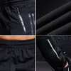 Pantalons de sport Hommes Courir Pantalon avec poches à glissière Entraînement et joggings Pantalons de fitness Sportwear pour hommes