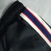 Pantaloni da uomo casual alla moda 21SS Pantaloni della tuta neri alla moda e versatili con pantaloni dritti larghi a righe con lettere