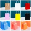 Multifunzione Borsa da imballaggio in carta Kraft colorata Maniglie durevoli Borsa per lo shopping di alta qualità Festival Borse regalo di nozze di compleanno Logo personalizzabile 21x15x8cm HY0194