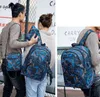 2025 최고 품질의 문 야외 가방 위장 여행 배낭 컴퓨터 가방 옥스포드 브레이크 체인 중학교 학생 가방 많은 색상 XSD1012
