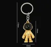 رائد الفضاء Keychain قلادة الإبداع الفضاء روبوت مفتاح سبيكة السيارة سحر رأس هدايا الذهب الأسود الفضة