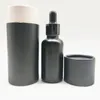 2021 30ml 50ml 100ml Cylindre noir mat Huile cosmétique Flacon compte-gouttes d'huile de parfum avec couvercle Alu Or Tube de boîte en carton en papier noir personnalisé