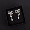 Fashion Girl Charm Earrings Bowknot Pearl Charming Ear Stud for Women Party Wedding Engagement Lovers Gift Smycken med Fast Deliv4583413