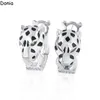 Donia jewelry luxury stud European and American fashion double ring leopard titanium steel micro-set zircon three-color creative designer earrings