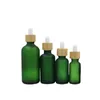 空の緑の霜のガラスエッセンシャルオイルのびんのゴム製の滴のバイアル竹の袋のリング蓋の化粧品包装充填容器5ml 10ml 15ml 20ml 30ml 50ml 100ml
