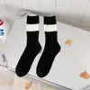 Mode hommes chaussettes unisexe heureux lettre Hip Hop collège Style Tube chaussettes basket rue Harajuku vent Couple sport chaussette