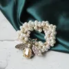 ヘアクリップバレットファッションシンプルサークル真珠の椿フラワーヘッドロープ小さな蜂ラバーバンド卸売