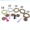 2021 personalized beaded wooden bead keychain, a variety of leopard print disc tassel pendant bracelet manufacturers wholesale