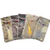 10 unids tassel cuello cuerda bolsa de teléfono celular cubierta chino seda brocado gafas bolsas de bolsas de bolsillo de embalaje de la joyería