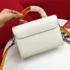 New Arrivals high quality Twist mid-size handbag Shoulder Bags Glass handle and colorful brand pendant Removable leather strap size23*17*9.5cm