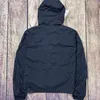 2023 Lens Solid Color Men's Simple Jacket Outdoor Tooling Assault Suft Lång ärm Huva Par Par Löst skjorta Leisure Fashion Mångsidig ny stil