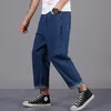 シンプルな男性の古典的なビジネスジーンズカジュアルな緩いハーランのズボンのビッグサイズの衣料品のための大きいサイズの服Pantalons de Grande Taille Pour Hommes