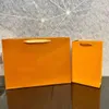 オレンジ色のギフト紙袋ハンドバッグトートバッグ高品質ファッション買い物袋卸売安価な01
