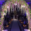 100ピースの人工シルクの花エレガントな藤の花の密な庭の結婚式のお祝いパーティーの装飾用品