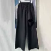 カジュアルな非対称女性全長パンツハイウエストレースアップ弓リッピングホール女性服のためのワイドレッグパンツ210521