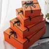 Orange presentförpackning kosmetisk läppstift förpackningslåda med svart båge knut 1200-1400g kartong festliga parti skor paket paperbox överraskning nuvarande papel de regalo